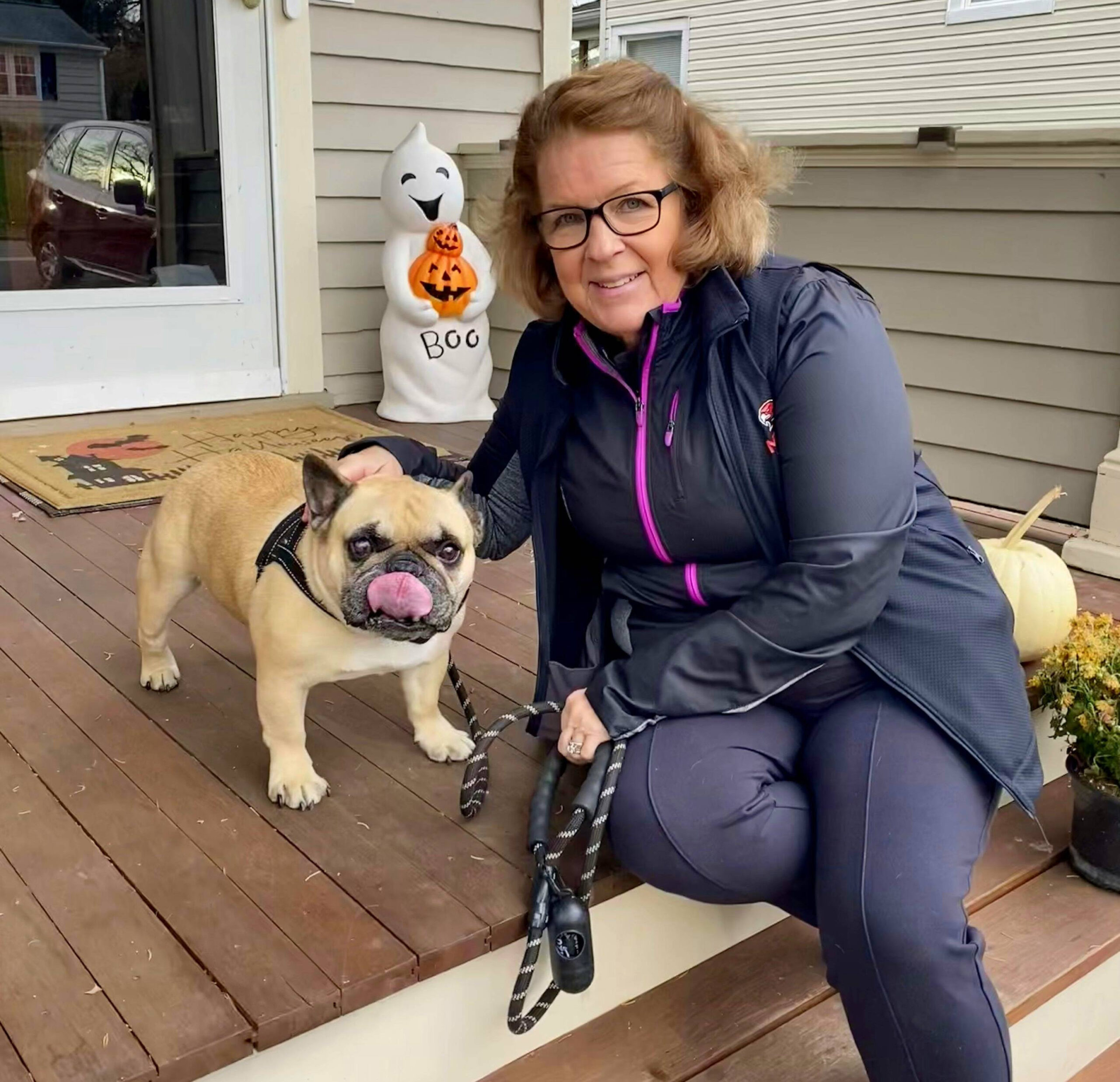 Alison sitting with Bruce on the front porch